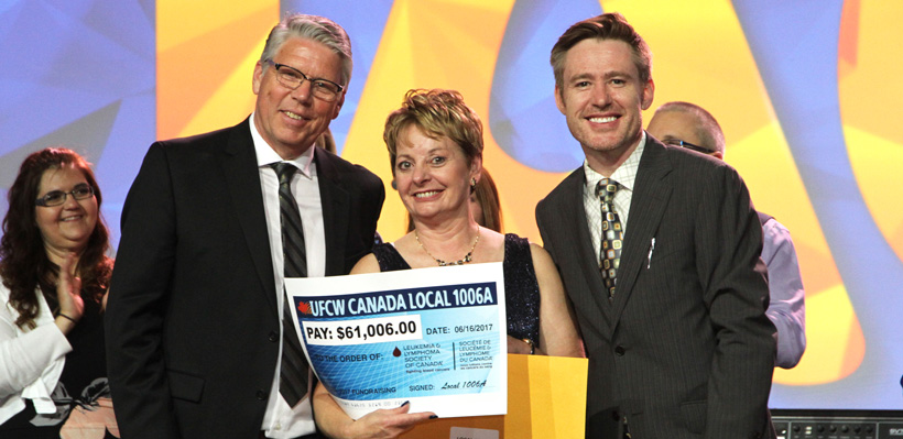 Fundraising Coordinator Diana O'Brien presents cheque at UFCW Canada's annual Leukemia Fundraising Gala.