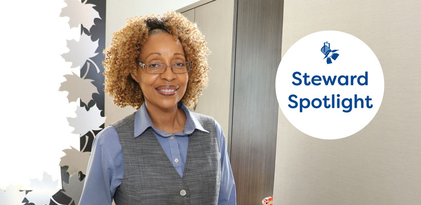 Steward Spotlight – 1006A member Cavel smiles while working at the front desk of the Hilton hotel. 