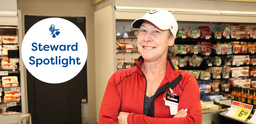 Union steward Marcia smiles with arms crossed at a Loblaws in Ottawa. 