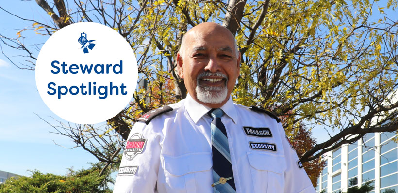 Vijay, a union steward from Paragon Security smiles in front of a tree at union office. 